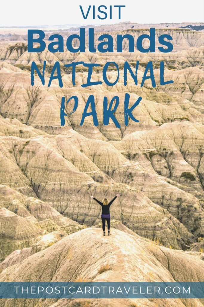 Person standing in Badlands National Park landscape.