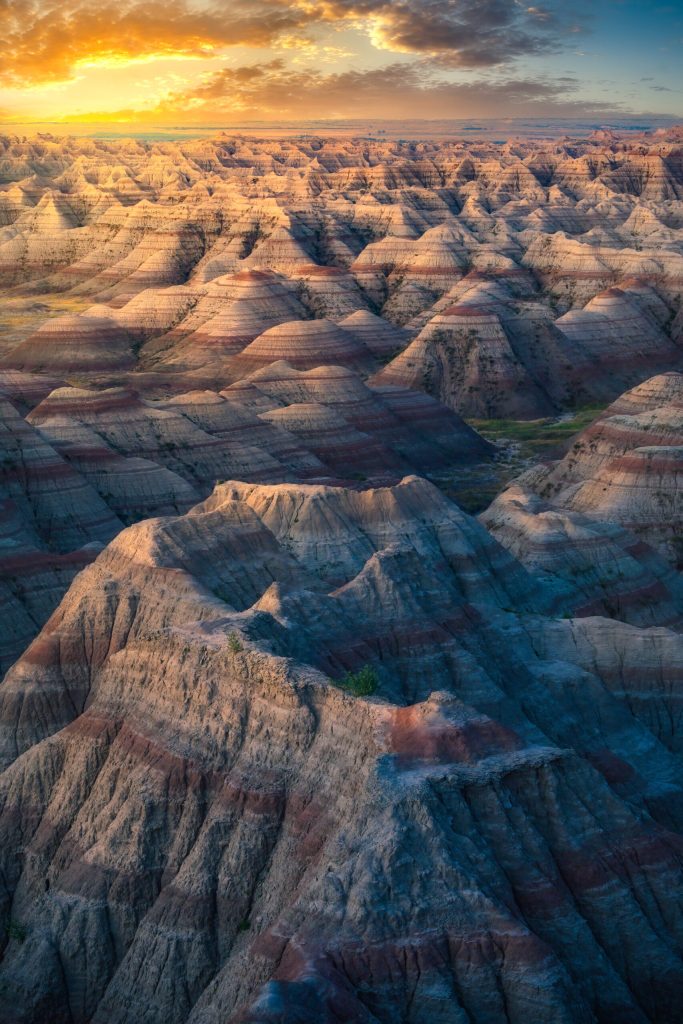Sunset over rugged mountain landscape.