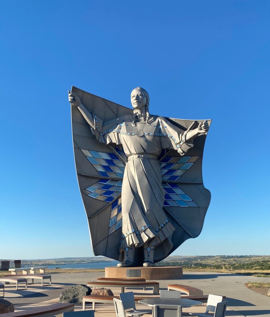 Statue of a Native American woman outdoors.